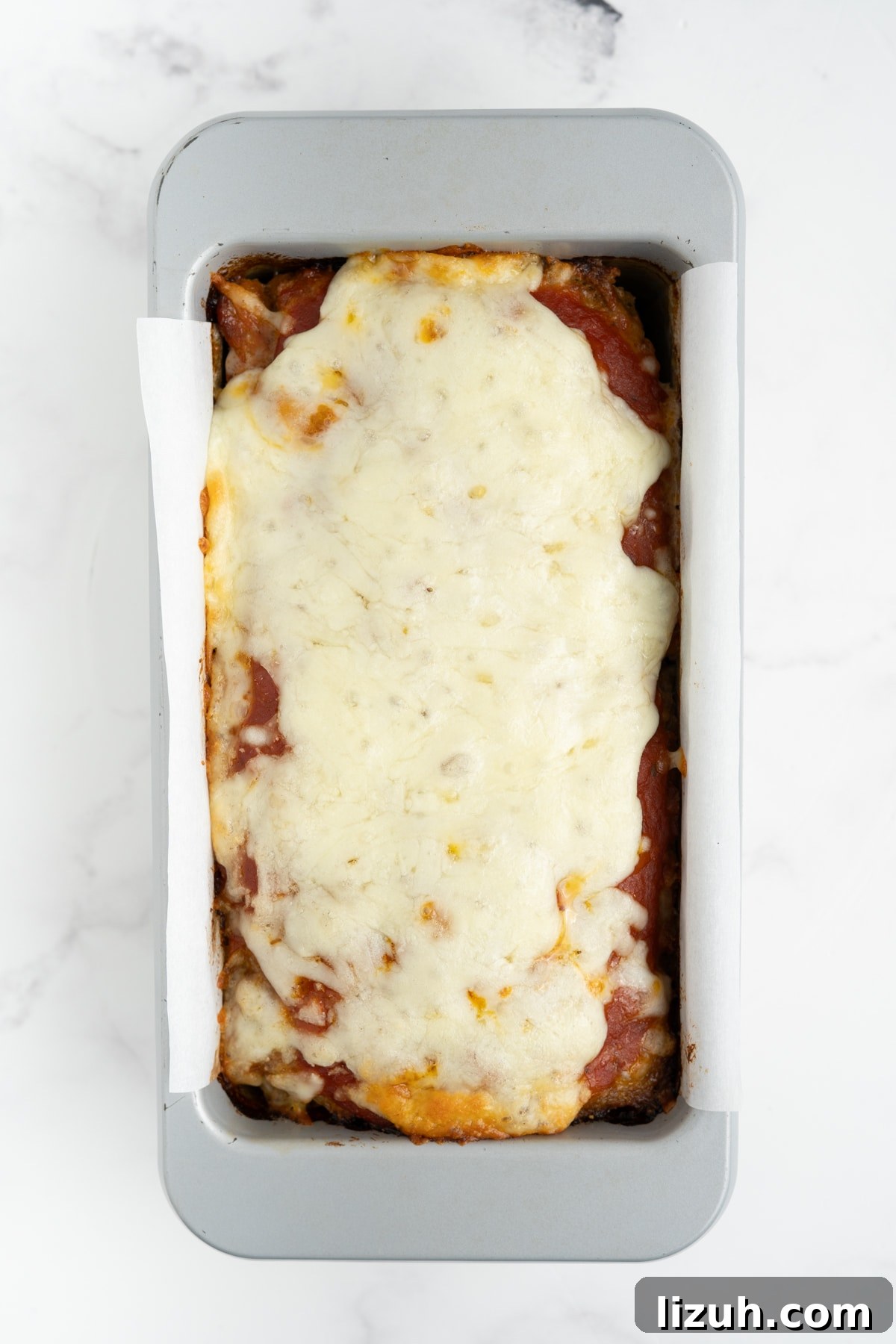 Melted cheese on the meatloaf.