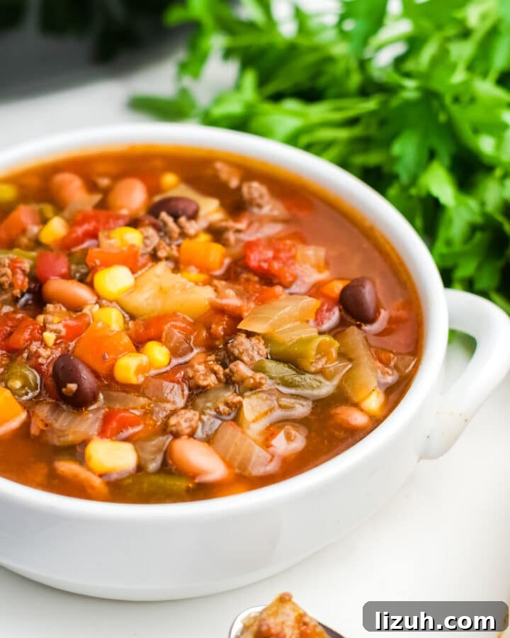 A white bowl filled with crockpot cowboy soup.