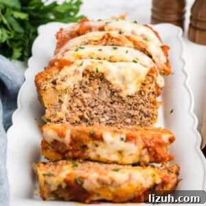 A platter with slices of meatloaf on it.