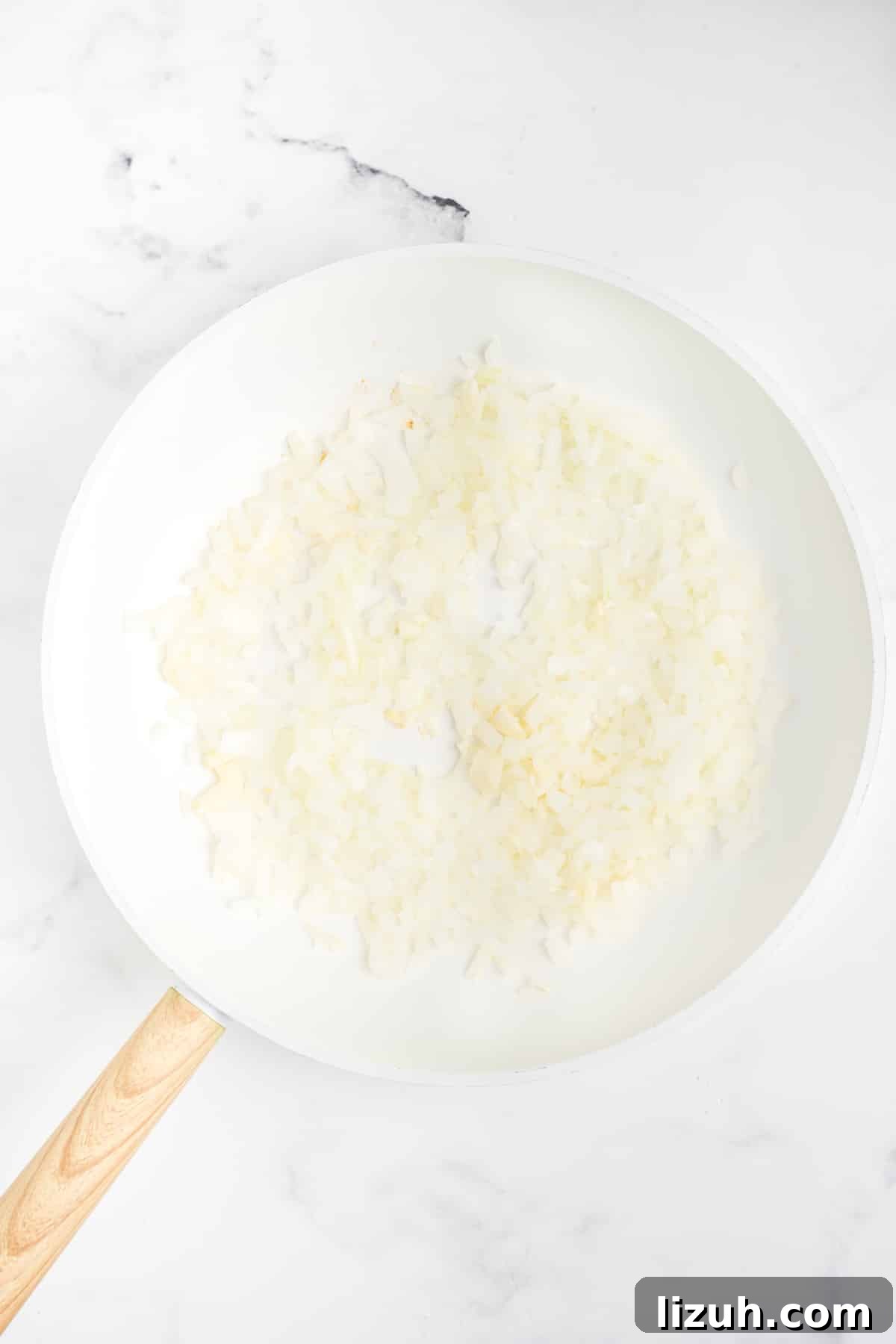 Onion and garlic in a pan.