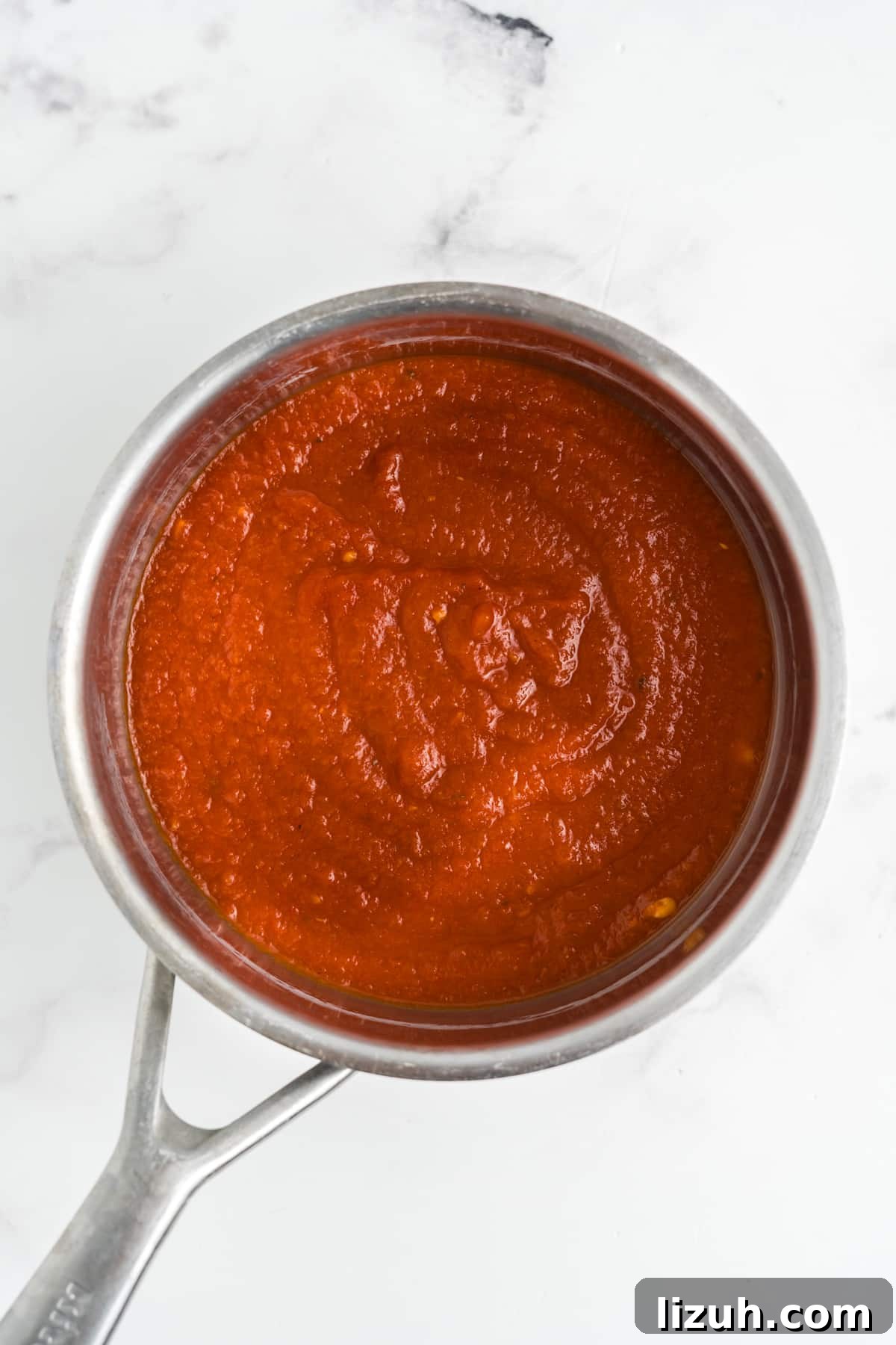 Marinara sauce in a saucepan.