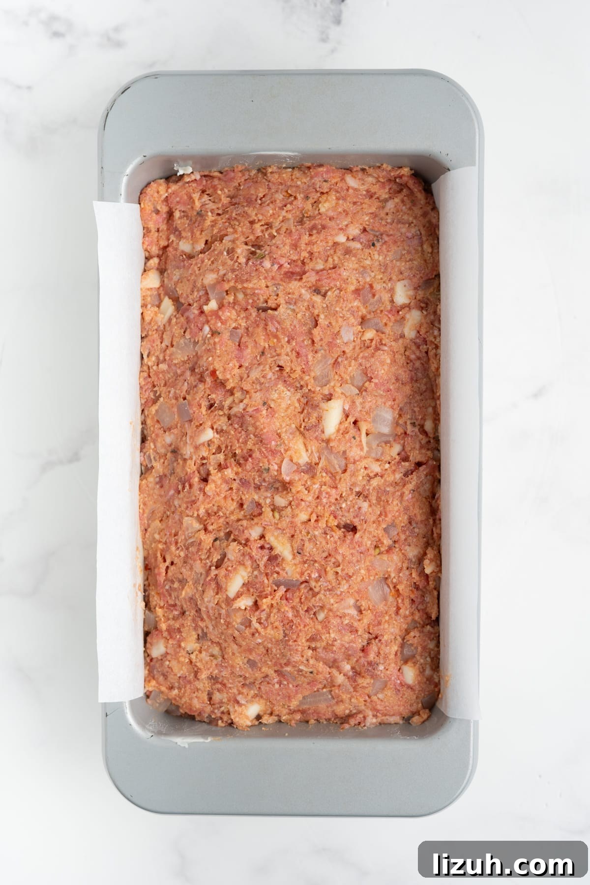 The mixture added to the prepared loaf pan.