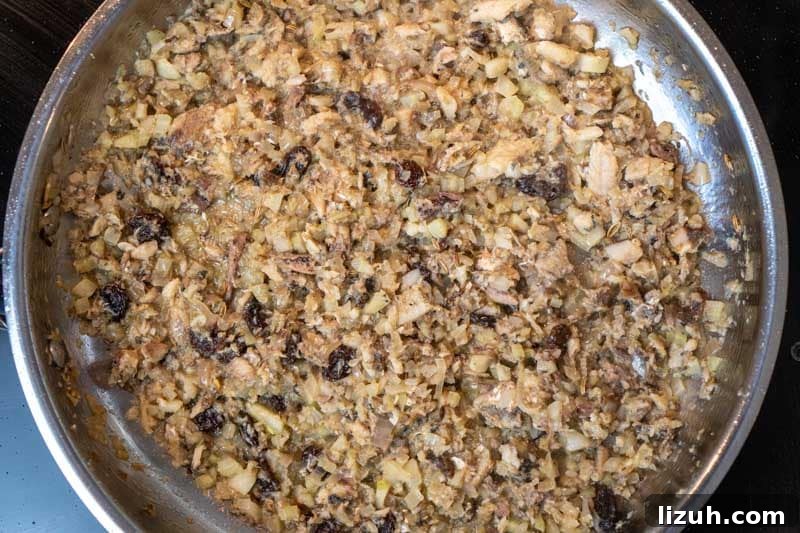 Deglazing the pan after adding in the sardines & sultanas