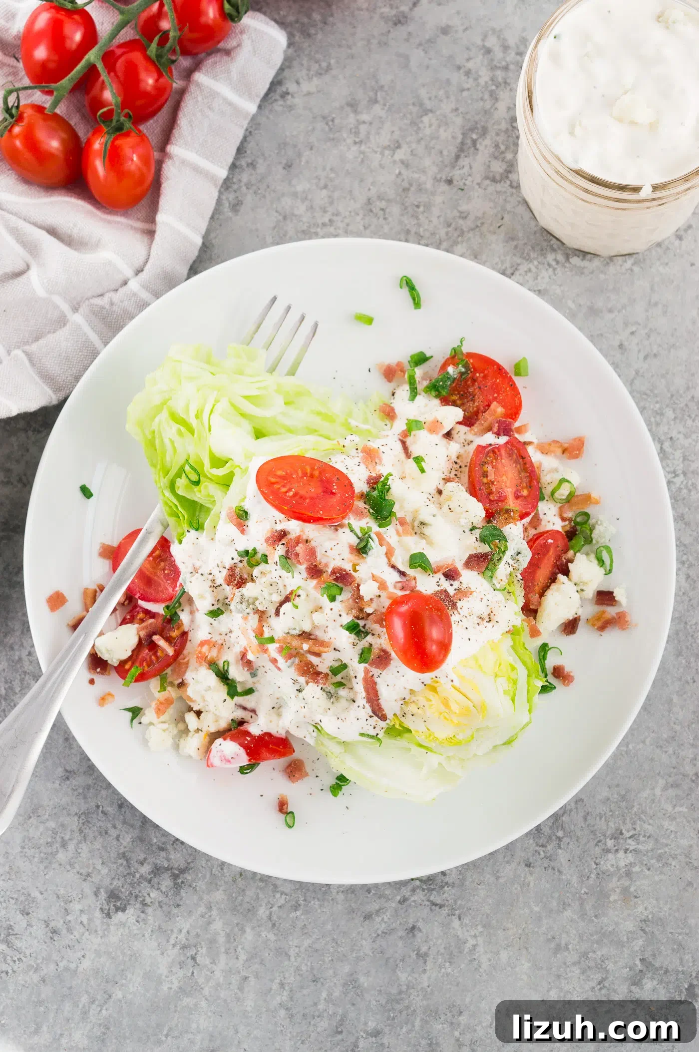 Classic Wedge Salad Recipe with Creamy Blue Cheese Dressing 6 blue cheese wedge salad recipe on a white plate
