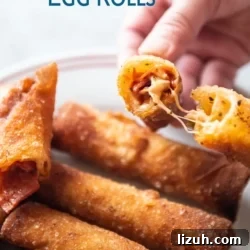 Cheesy pepperoni pizza egg rolls recipe on a plate by bestrecipebox.com