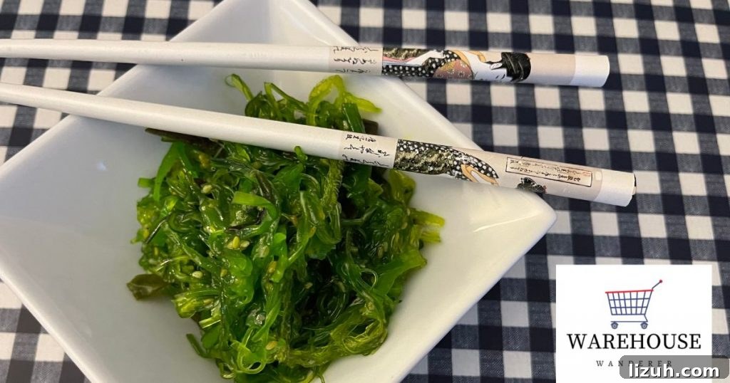A picture of costco seaweed salad in a bowl with chopsticks