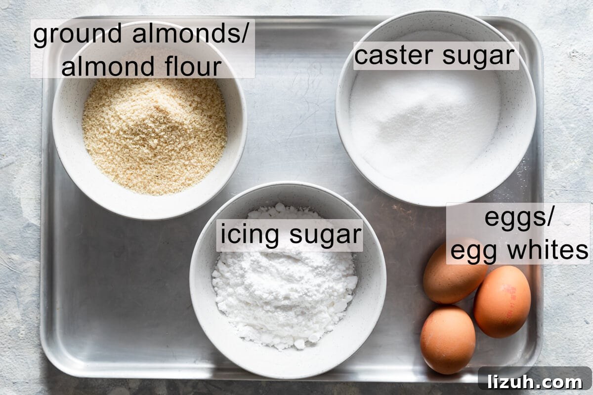 Irresistible Salted Caramel Macarons Recipe for Perfect Results 3 bowls with the ingredients for macarons with text labels.