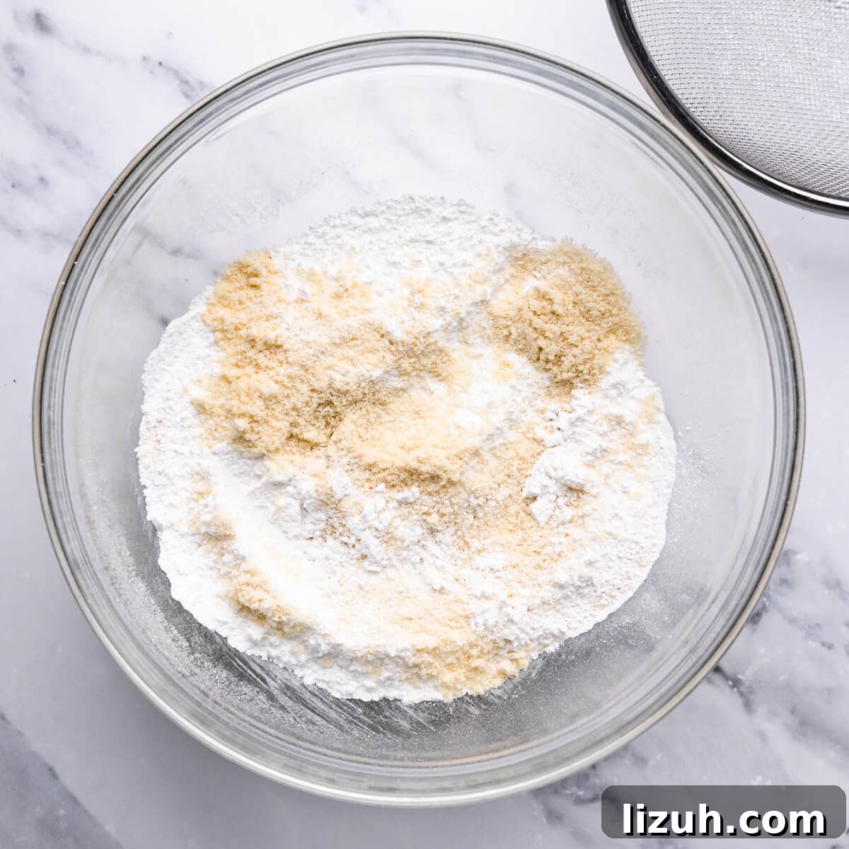 Irresistible Salted Caramel Macarons Recipe for Perfect Results 5 bowl with sifted icing sugar and ground almonds.