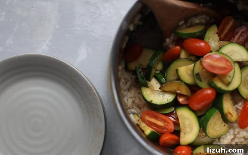 Zucchini risotto with rice and tomatoes.