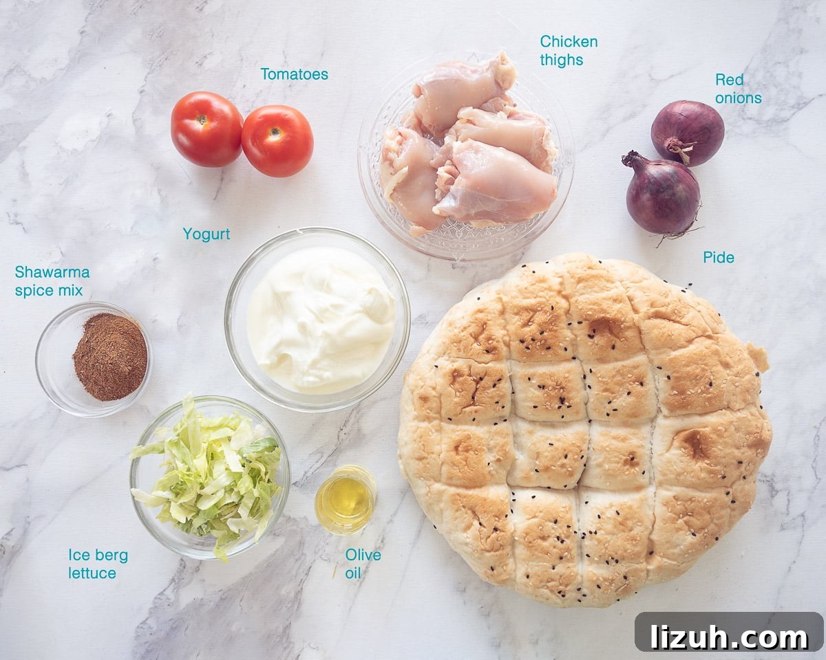 ingredients Homemade Chicken Doner Kebab, individually labelled on a white marble background