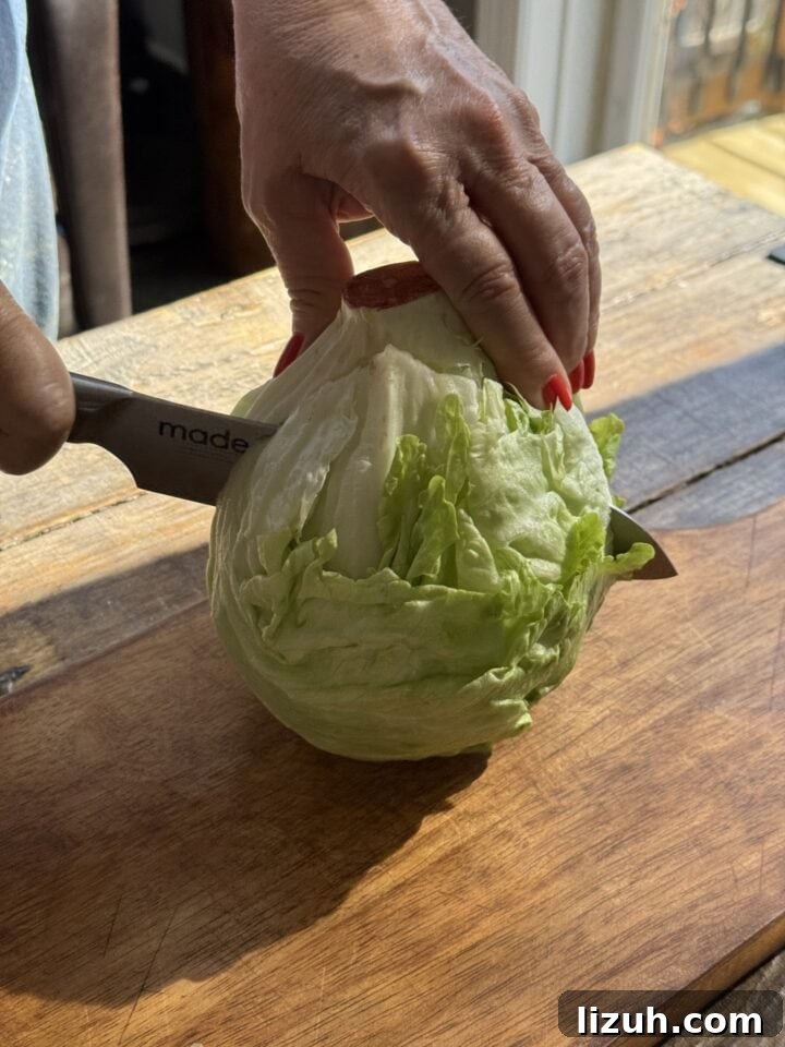 Quick Weeknight Ground Chicken Burgers Recipe 8 a photo slicing a head of iceberg