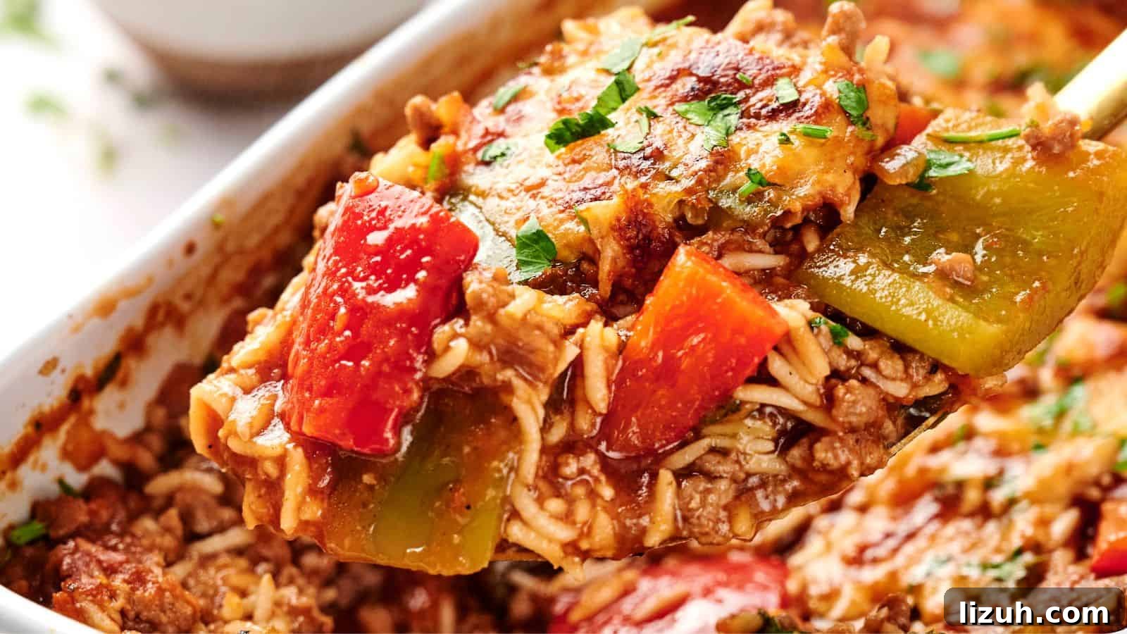 35 Game-Day Recipes to Win Your Season’s Food Lineup 16 A spoonful of stuffed pepper casserole with ground meat, red and green bell peppers, cheese, and rice, garnished with herbs.