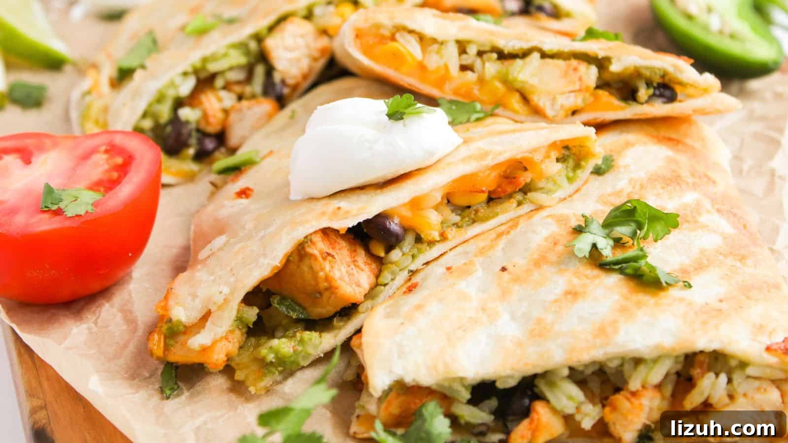 35 Game-Day Recipes to Win Your Season’s Food Lineup 23 Quesadillas filled with rice, beans, and chicken, topped with sour cream and cilantro. Sliced tomato and jalapeño are on the side.