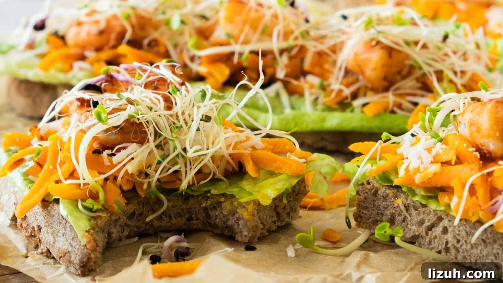 35 Game-Day Recipes to Win Your Season’s Food Lineup 28 Close-up of open-faced sandwiches topped with avocado, shredded carrot, microgreens, and pieces of cooked salmon on whole-grain bread.