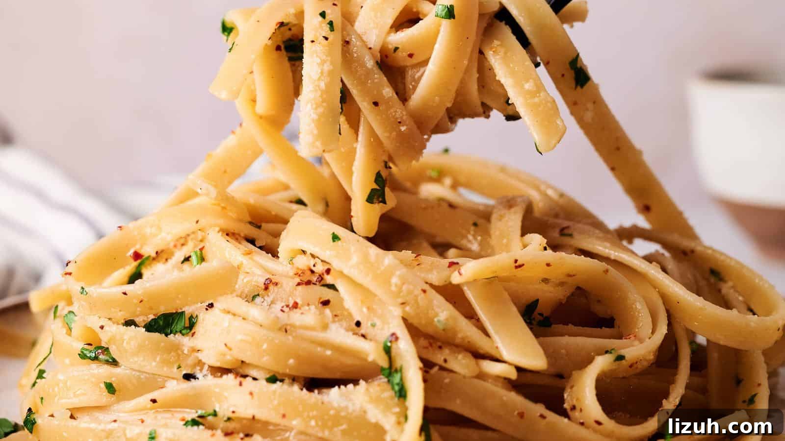 35 Game-Day Recipes to Win Your Season’s Food Lineup 34 Close-up of fettuccine pasta tossed with grated cheese, chopped parsley, and red pepper flakes being lifted with a fork.