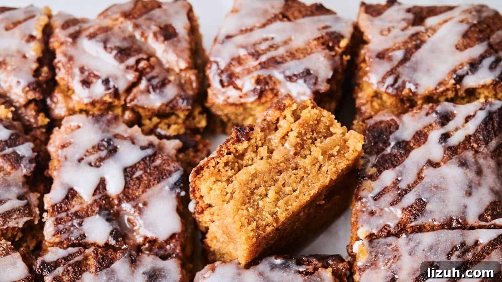 35 Game-Day Recipes to Win Your Season’s Food Lineup 9 Close-up of sliced crumbly cakes topped with white icing. One piece is positioned vertically to show its texture.