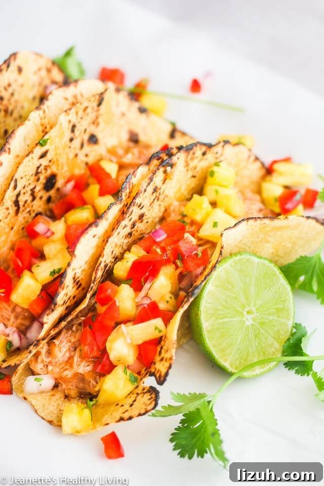 Slow Cooker Chicken Tinga Tacos: Savory Spicy Mexican Recipe 7 Crockpot Shredded Hawaiian Chicken Tacos - the filling for these tacos is sweet and tangy. Versatile too - can also be served in a rice bowl or on a bun with some slaw