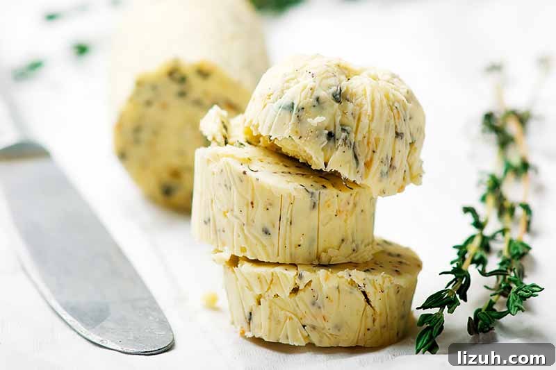 9 Delicious Tricks to Boost Flavor in Steamed Vegetables 11 Horizontal image of sliced of compound butter next to fresh thyme.