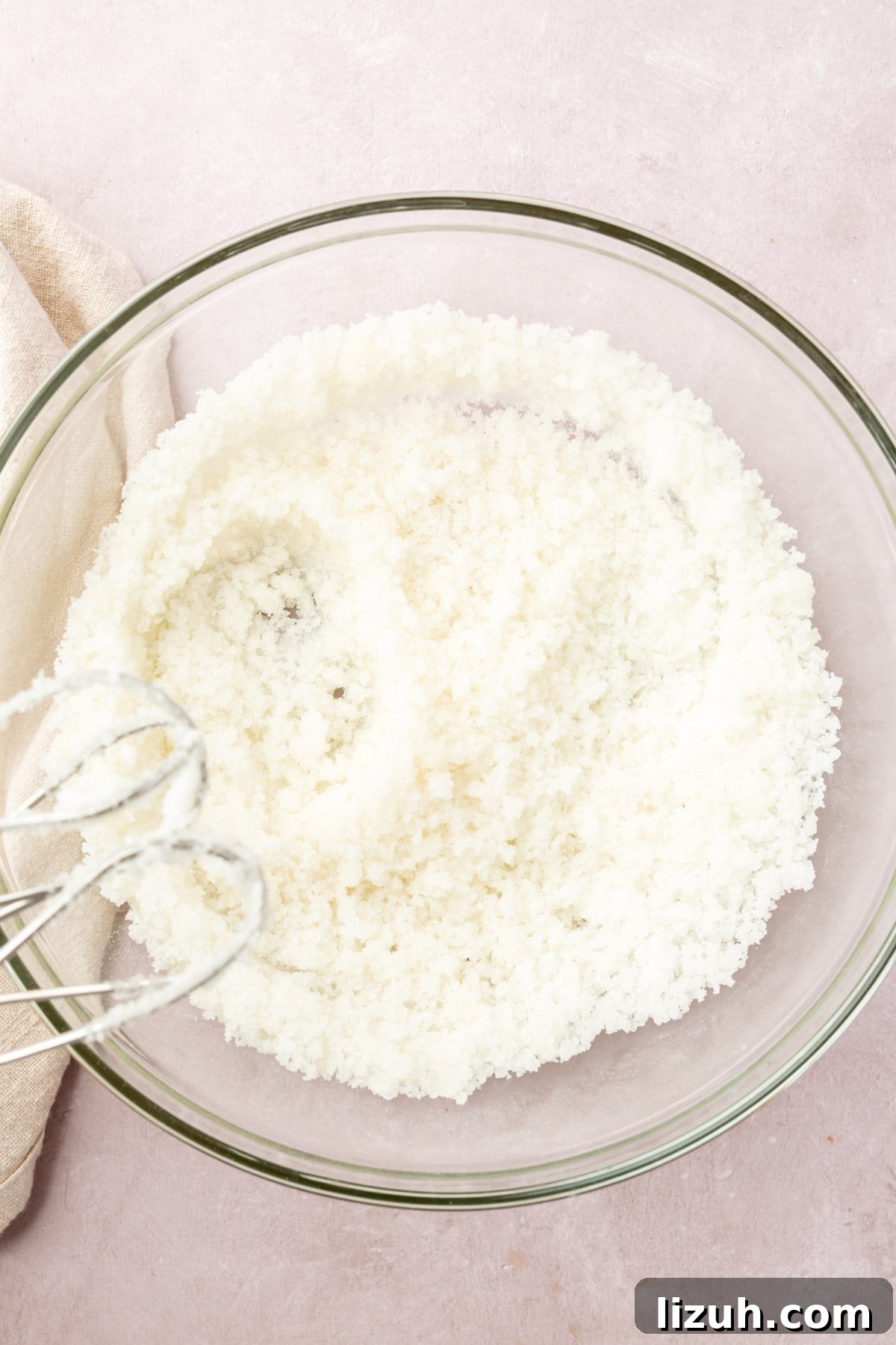 Gluten-Free Red Velvet Cake Recipe: Moist, Rich & Simple to Make 6 Oil and sugar being mixed in a glass mixing both with an electric mixer.