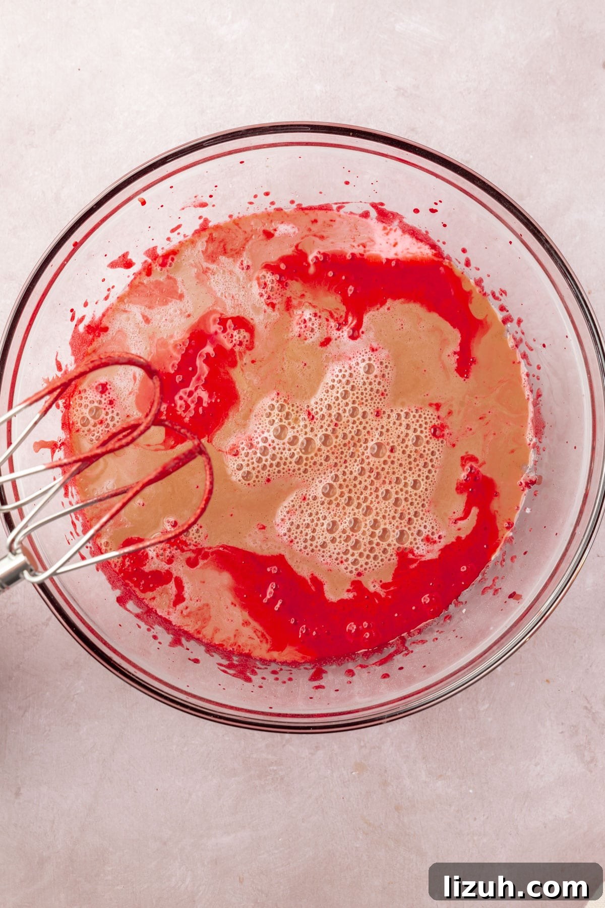 Gluten-Free Red Velvet Cake Recipe: Moist, Rich & Simple to Make 8 Red cake batter, coffee, and buttermilk in a glass mixing bowl with two beaters.
