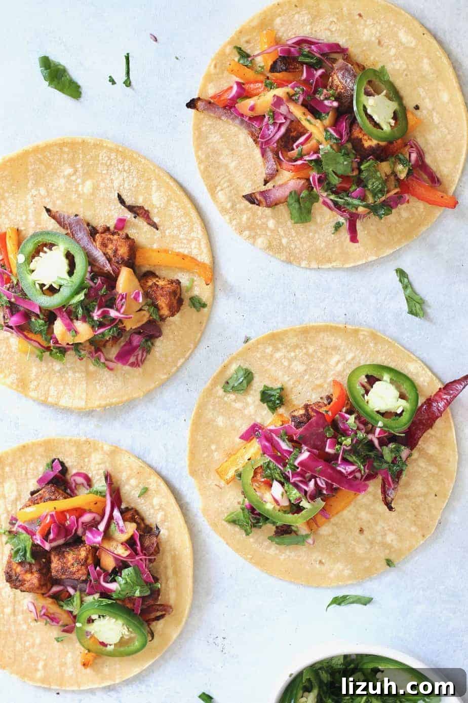 Zesty Tofu Tacos with Peaches and Crunchy Cabbage Slaw 3 Change the tofu game with these delicious Zesty Sheet Pan Tofu Tacos with Peach Kale Slaw! A fresh, flavorful, wholesome meal the entire family will devour. Vegan + gluten-free.