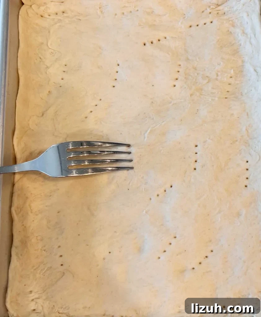 poke holes in pizza crust with fork