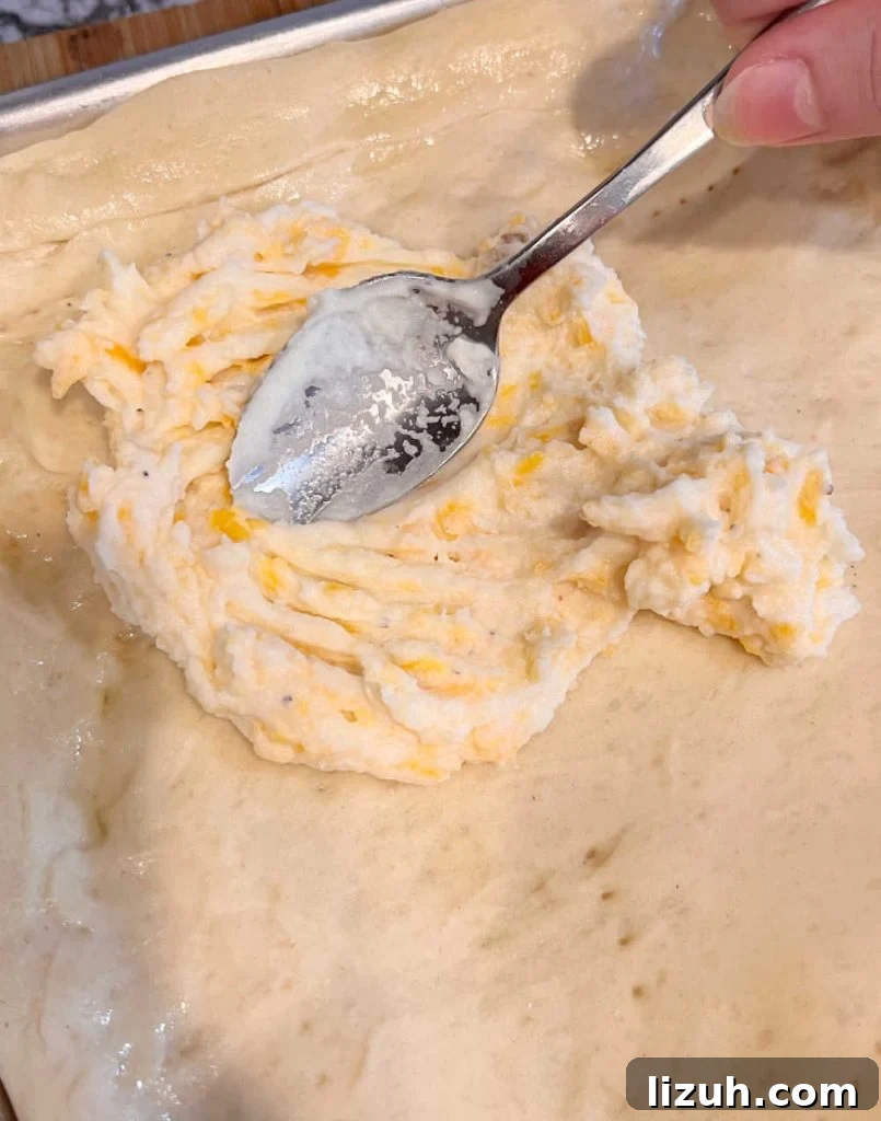 spread cheese mash potatoes on pizza crust