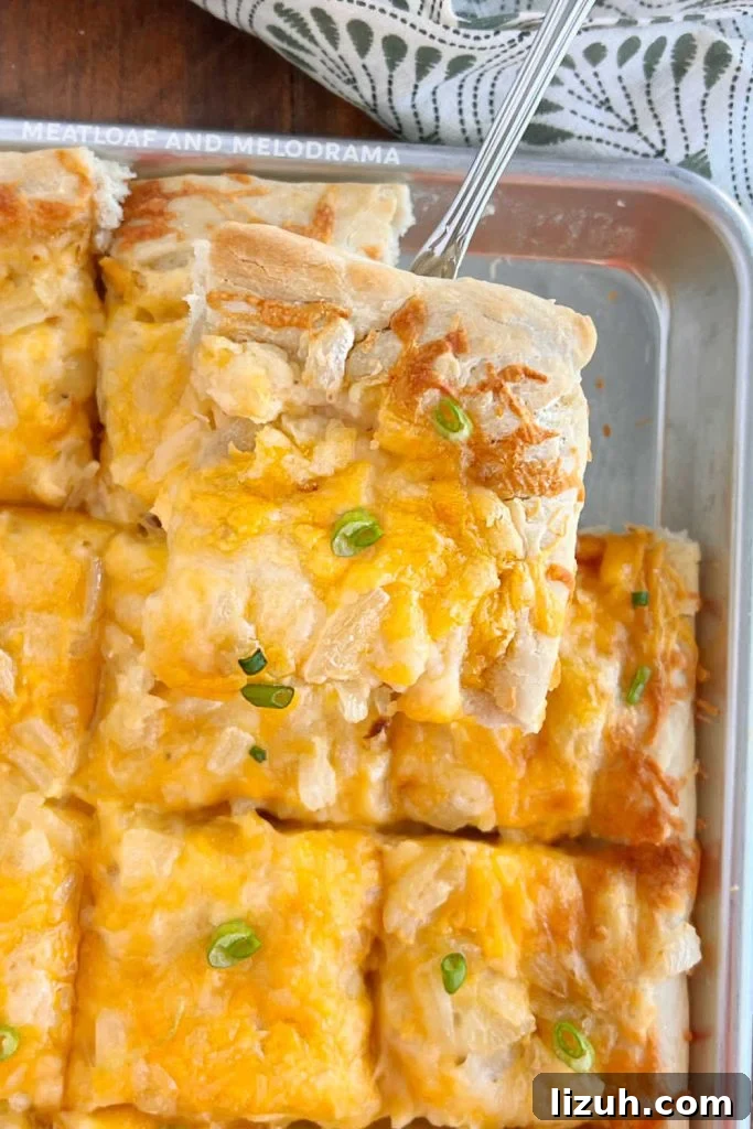 slice of pierogi pizza on spatula