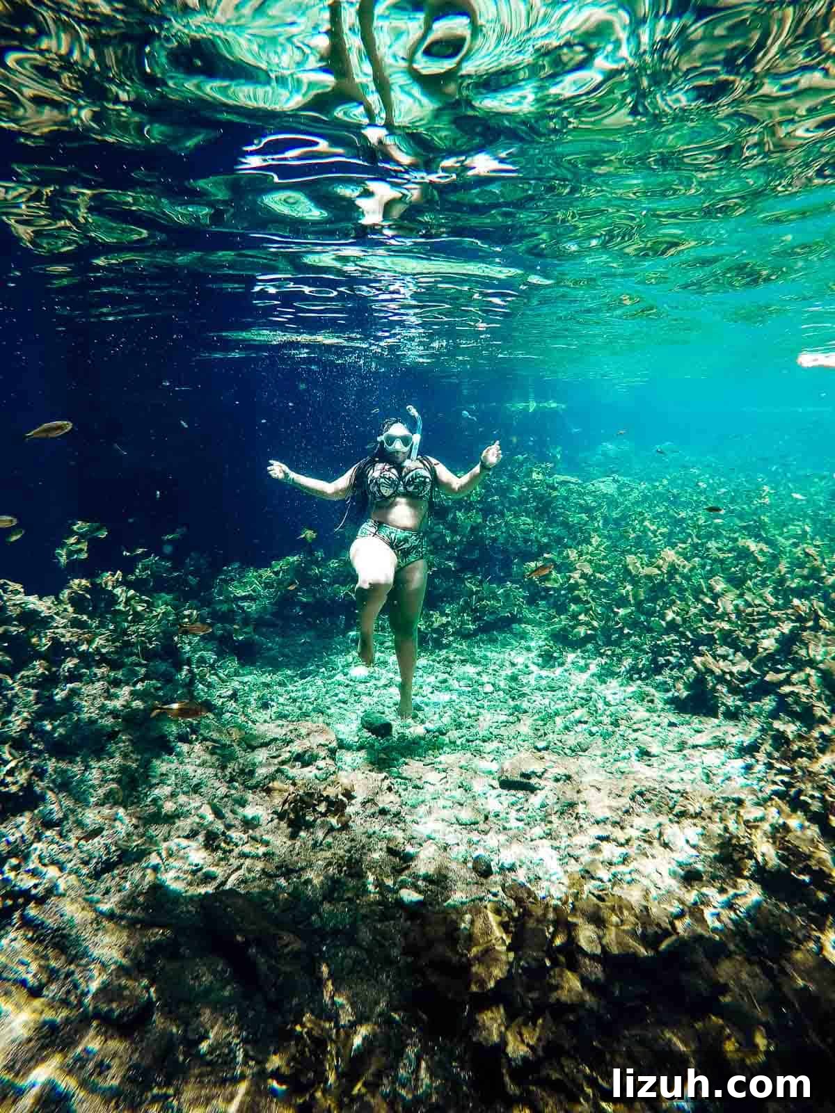 Tulum Travel Guide: Top Food, Where to Stay & Things to Do 3 Jessica underwater, scuba diving.