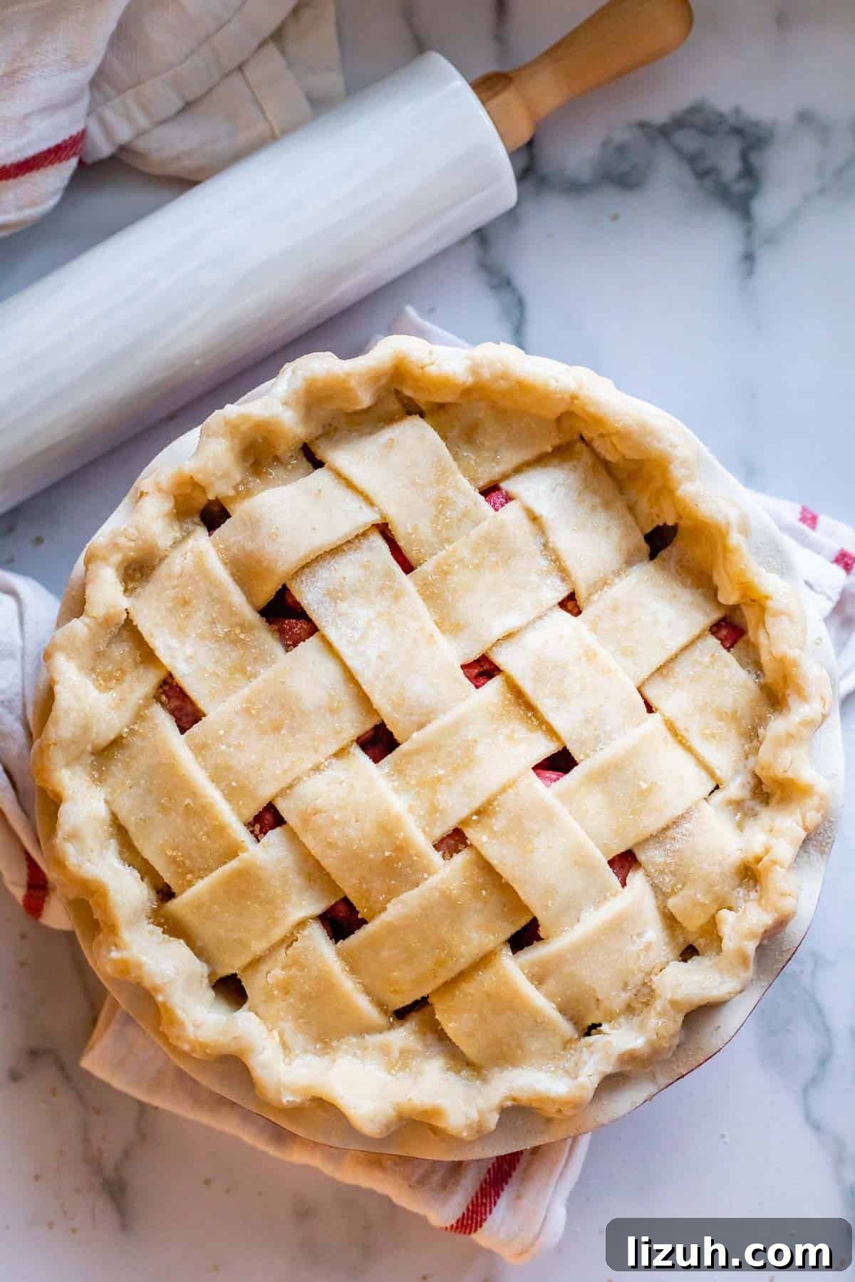 raw lattice pie crust with crimped edges