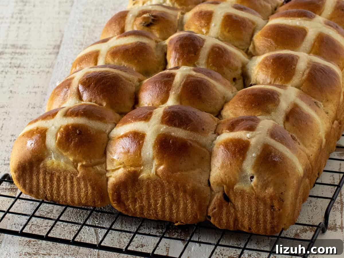 Buns cooling on a wire rack.