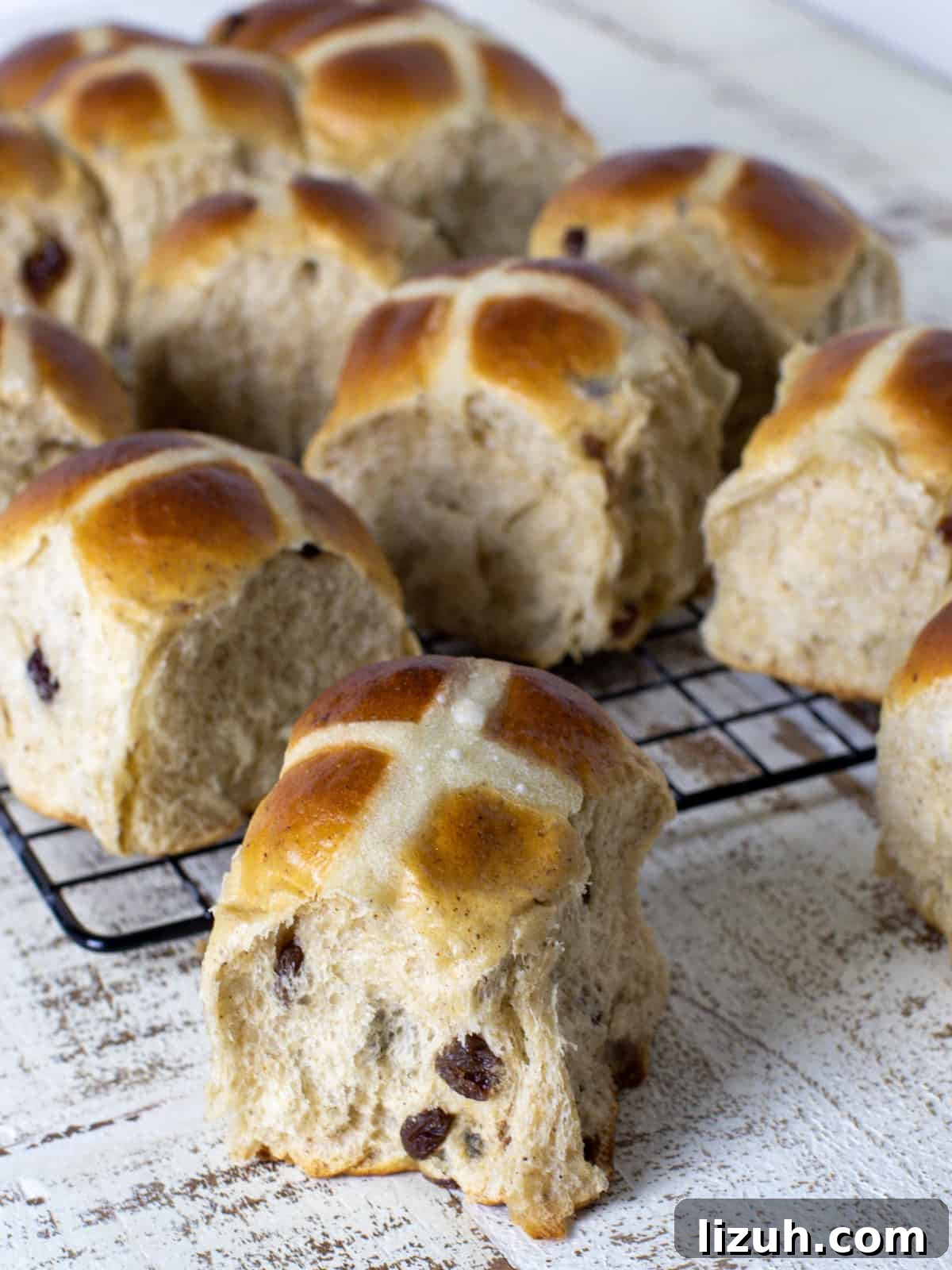 Buns resting on a wire rack.