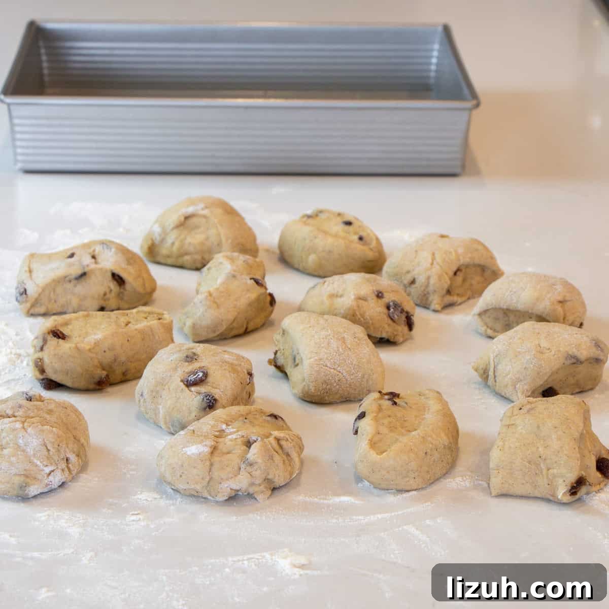 Twelve equal sized portions of dough.