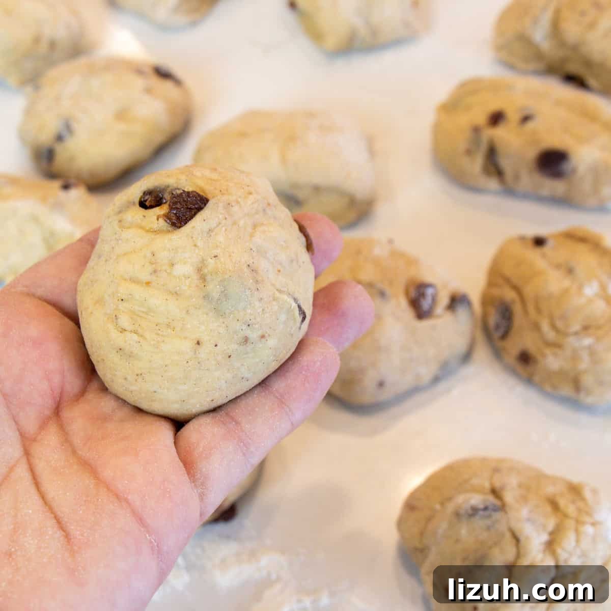 Portion of dough formed into a roll.