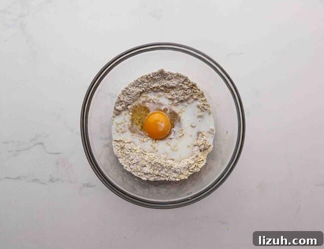Single-Serve Oatmeal Protein Pancakes: Quick High-Protein Recipe 5 Oat flour and an egg in a bowl.