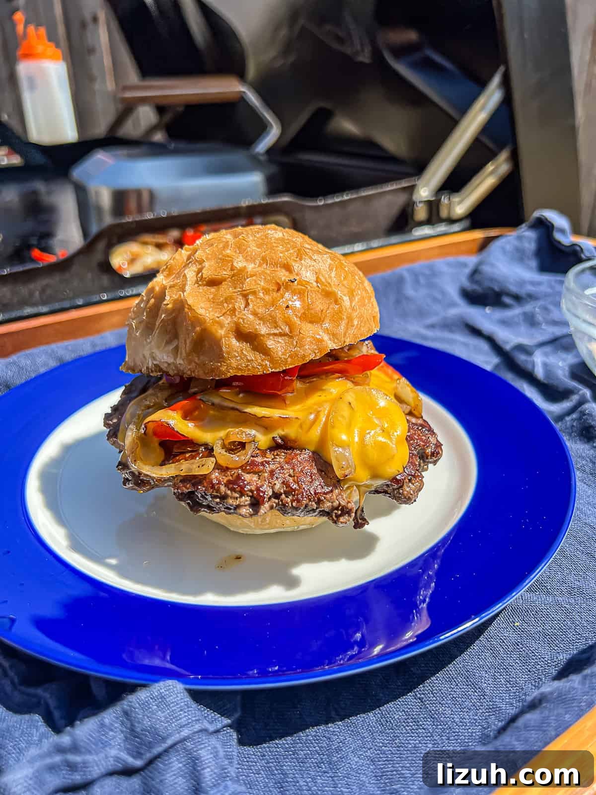 Burger BBQ food in front of Traeger Flatrock Griddle Grill