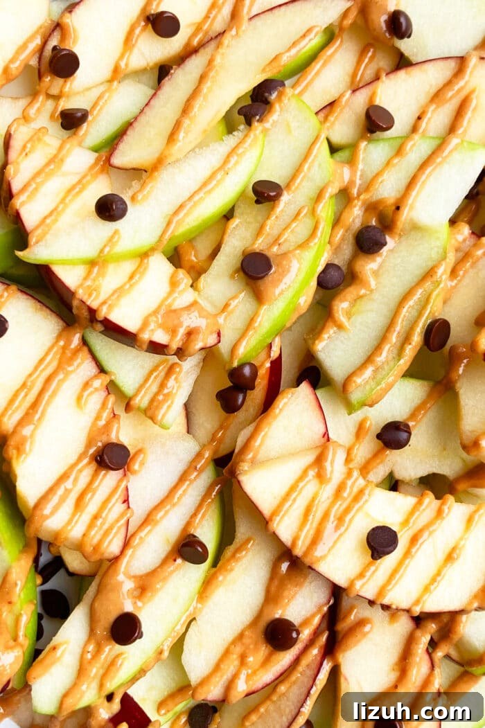 Apple Nachos Recipe: Crispy Sliced Apples with Toppings 3 Closeup Shot of homemade Apple Nachos- Overhead Shot
