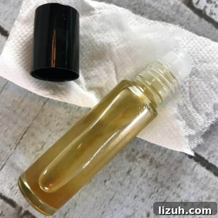 Revitalize Tired Feet with Cooling Rollerball Relief 7 wiping outside of essential oil rollerball with rubbing alcohol so that it's clean before putting on label