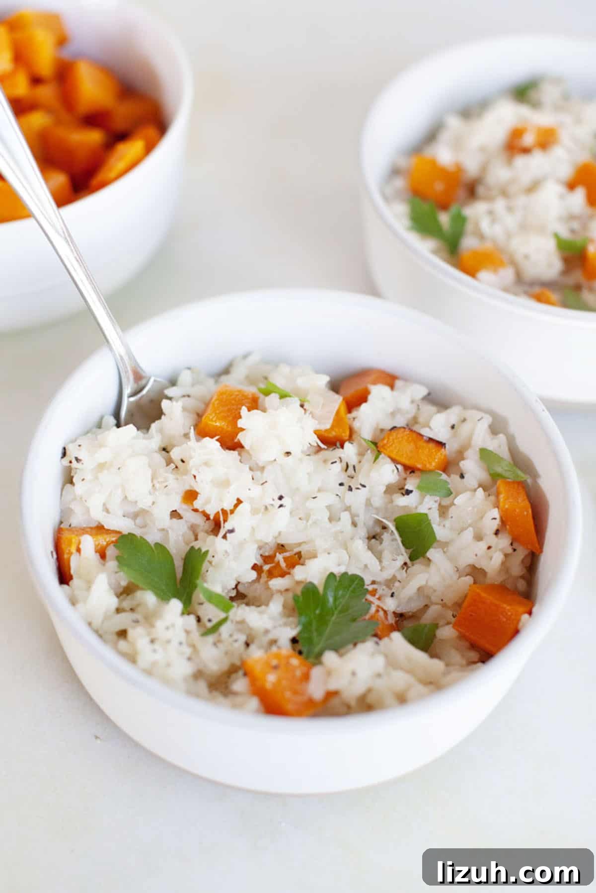 Two bowls of butternut squash risotto.