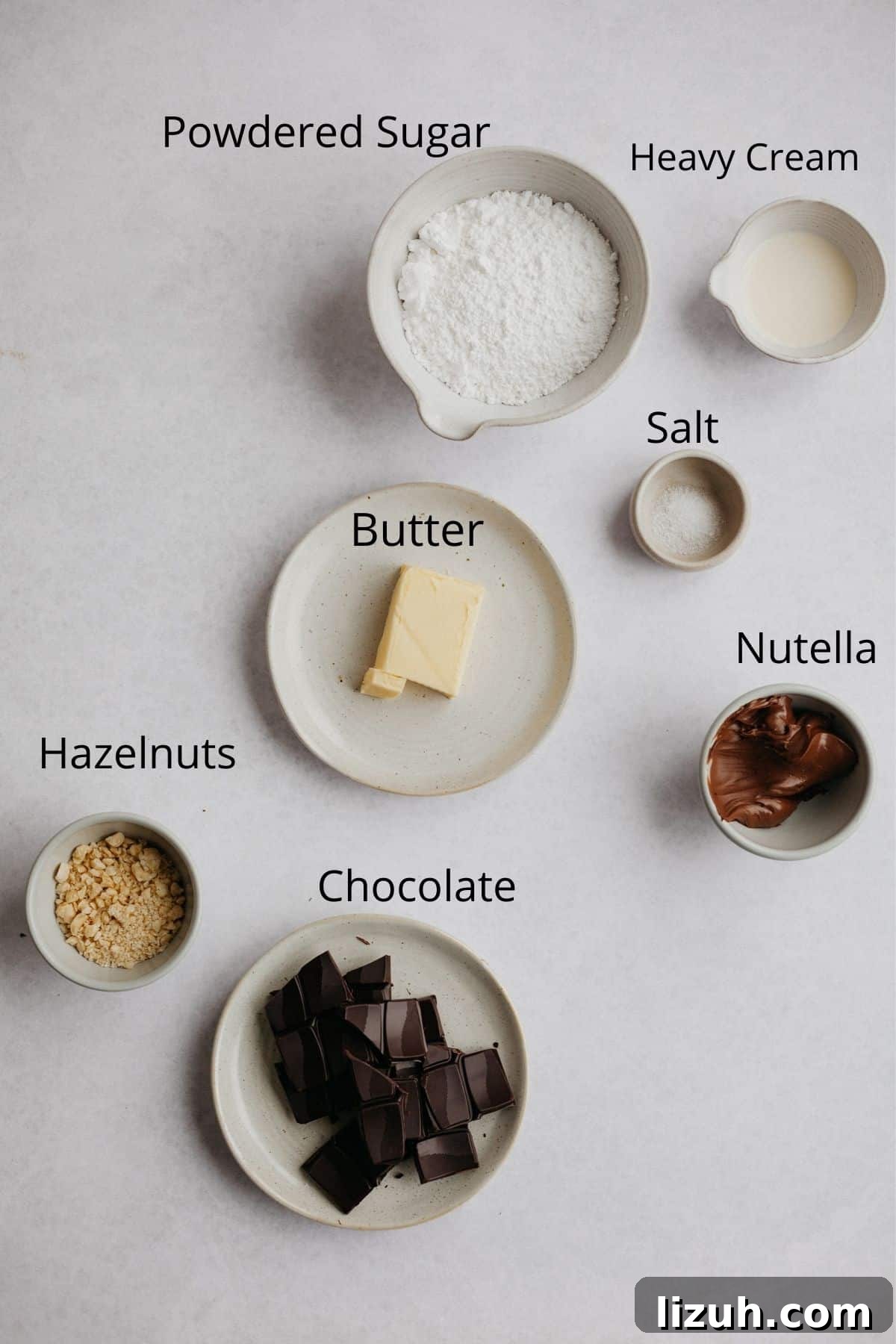 Nutella-Filled Chocolate Macarons: Classic French Cookie Recipe 10 An overhead shot of all the ingredients for nutella buttercream filling