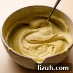 pistachio cream in a bowl with a spoon.