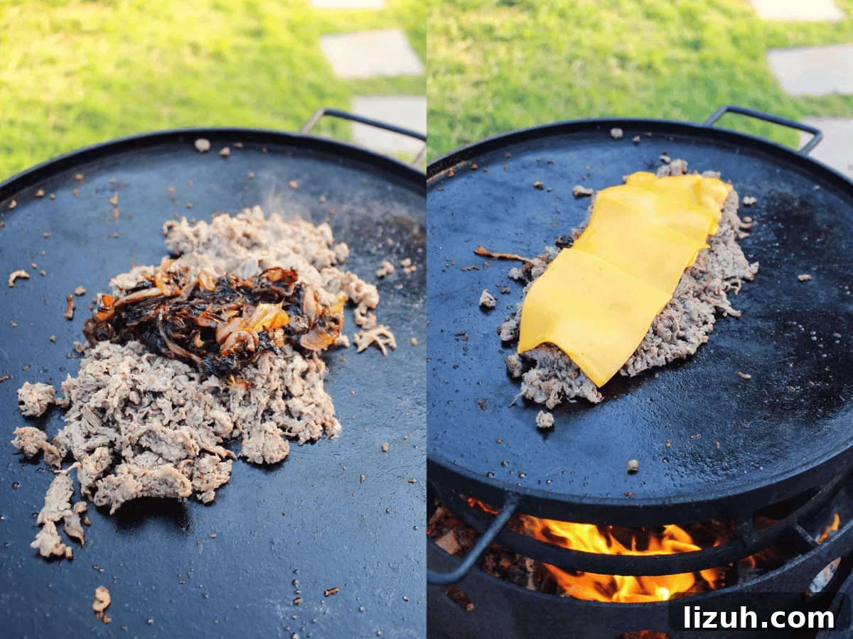 Adding the onions back to the cooked steak and topping it all with cheese.