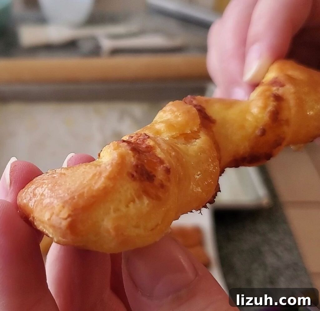 Crispy Gluten-Free Cheese Straws Made with Puff Pastry 4 up close picture of baked puff pastry cheese straws