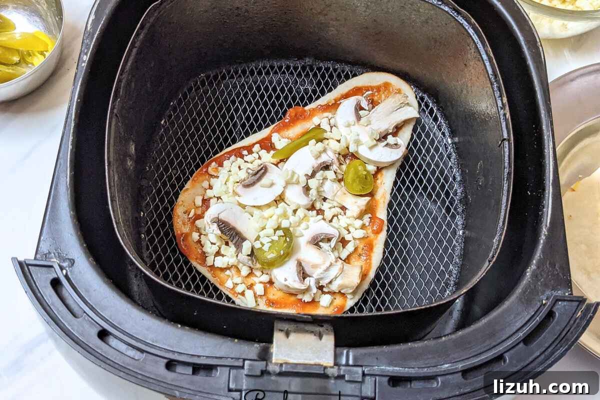 Naan pizza in air fryer basket