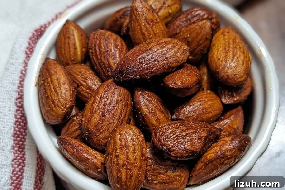 Roasted almonds served in a white bowl
