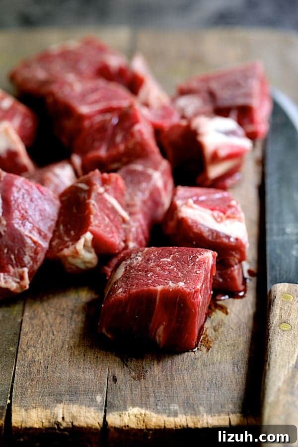 Indian Beef Kabobs with Cilantro Coconut Sauce recipe 4 Cubed beef on wood cutting board