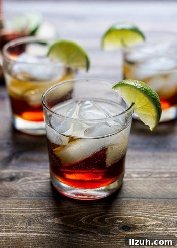 Pumpkin Spice Dark and Stormy Cocktail Recipe 7 A Pumpkin Spice Dark and Stormy Cocktail on a wooden surface.