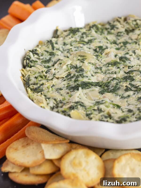 Pepperoni Pizza Cheese Ball Game-Day Appetizer 11 Serving spinach and artichoke dip without mayo and with crackers and carrots.