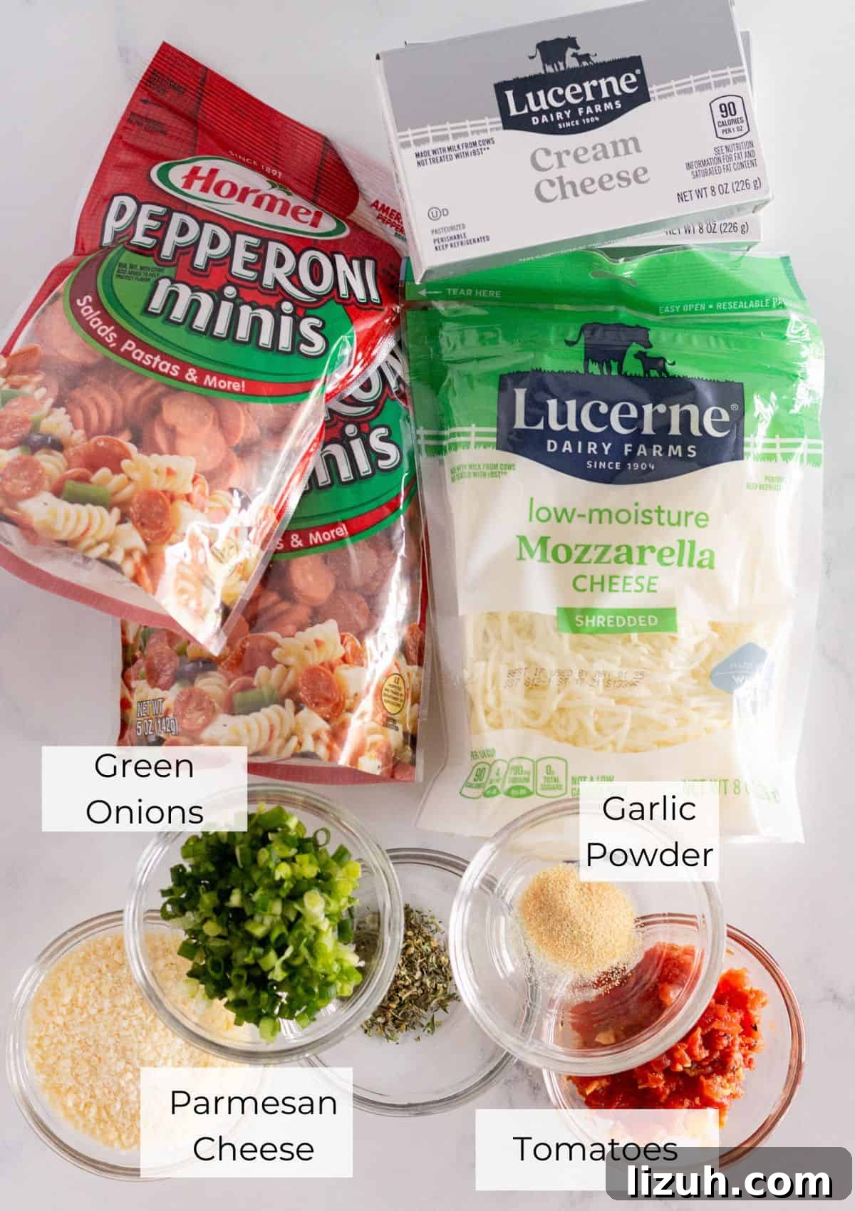 Pepperoni Pizza Cheese Ball Game-Day Appetizer 3 The ingredients needed to make a football pepperoni pizza cheese ball.