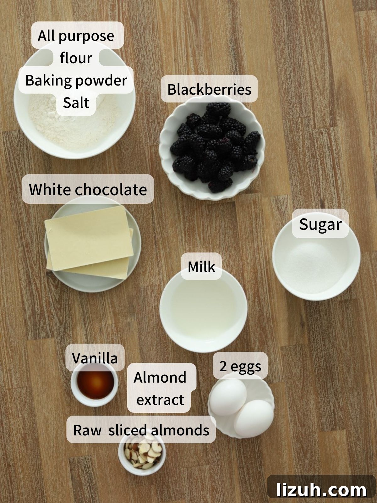 Moist Blackberry Almond Cake Recipe with Crisp Almond Topping 3 Labeled ingredients needed to make blackberry almond cake laid out on a table.